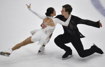 Audrey Lu and Misha Mitrofanov of USA perform in the pair's free skating program during the ISU Four Continents Figure Skating Championships in Tallinn, Estonia, Saturday, Jan. 22, 2022. (AP Photo/Sergei Stepanov)