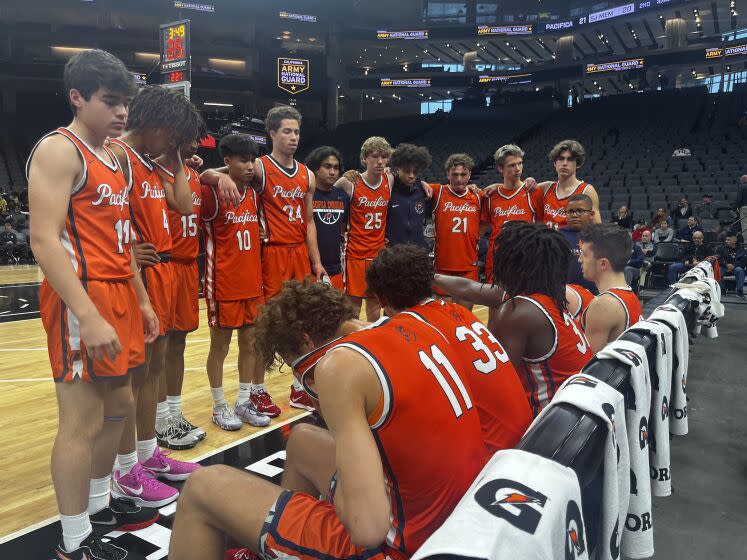 Pacifica Christian players try to regroup during Division II state championship loss to San Joaquin Memorial.