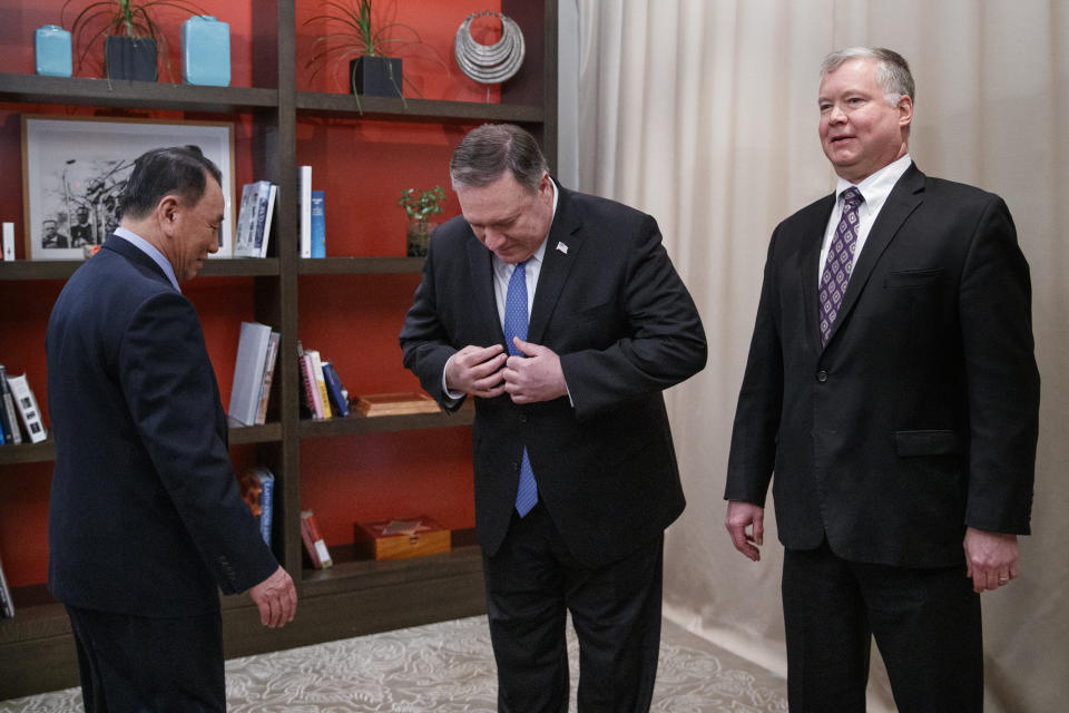 From left, Kim Yong Chol, a North Korean senior ruling party official and former intelligence chief, Secretary of State Mike Pompeo, and U.S. Special Representative for North Korea Stephen Biegun, arrive to pose for photographs at the The Dupont Circle Hotel in Washington, Friday, Jan. 18, 2019. (AP Photo/Carolyn Kaster)