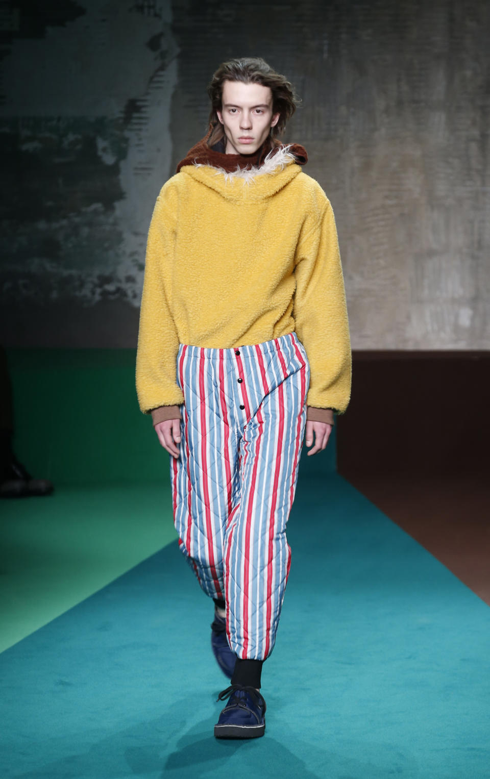 A model wears a creation for the Marni men's Fall-Winter 2017-2018 collection, part of the Milan Fashion Week, unveiled in Milan, Italy, Saturday, Jan. 14, 2017. (AP Photo/Antonio Calanni)