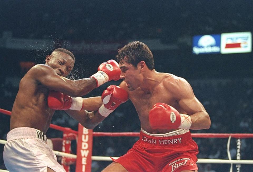 12 Apr 1997: Oscar De La Hoya lands a right to Pernell Whitaker during a fight at the Thomas and Mack Center in Las Vegas, Nevada. De La Hoya won the fight by decision. Mandatory Credit: Al Bello /Allsport