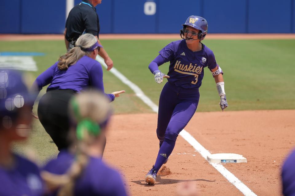 Washington's Rylee Holtorf (3) runs home after hitting a two-run home run in the second inning of a softball game between Utah and Washington in the Women's College World Series at USA Softball Hall of Fame Stadium in Oklahoma City, Friday, June 2, 2023. Washington won 4-1.