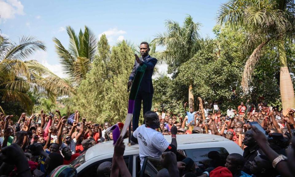 Bobi Wine addresses a crowd outside his home in Kampala on Thursday.