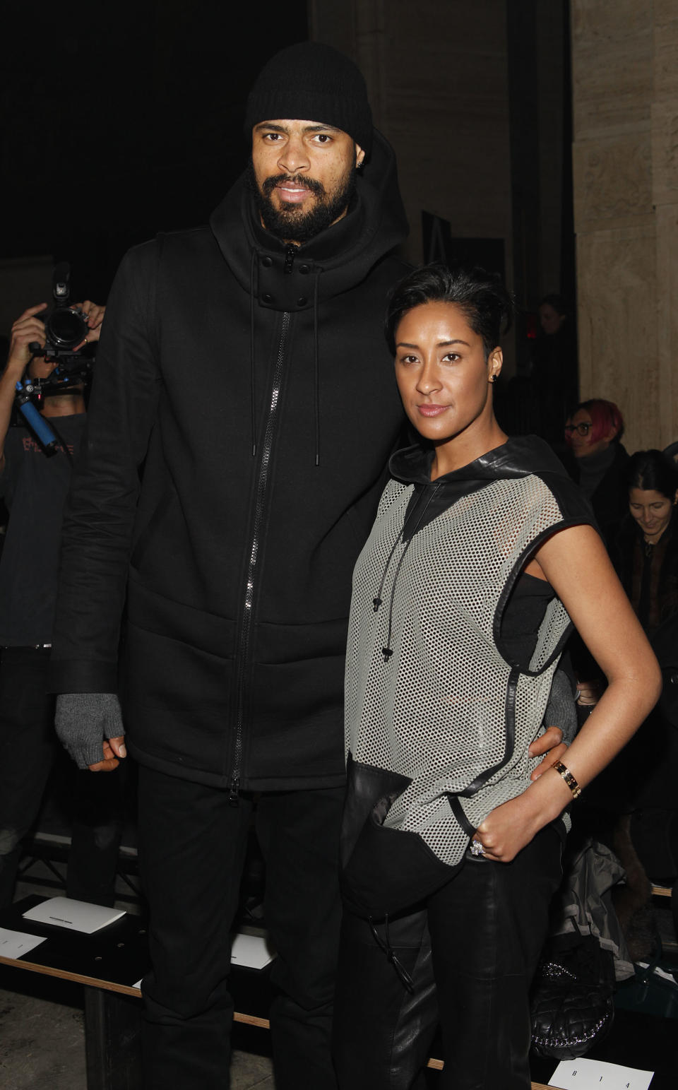 FILE - This Feb. 8, 2013 file photo, NBA star Tyson Chandler and his wife Kim Chandler are seen at the Fall 2013 Alexander Wang Runway Show, in New York. Tall, trim and wearing catwalk clothes: Pro basketball stars have stepped up their style to become influential tastemakers. .Pro player style has been on the upswing for the past decade, especially since the NBA initiated a dress code in 2005, according to observers. (Photo by Amy Sussman/Invision/AP, file)