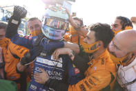 Mclaren driver Daniel Ricciardo of Australia celebrates after winning during the Italian Formula One Grand Prix, at Monza racetrack, in Monza, Italy, Sunday, Sept.12, 2021. (Lars Baron/Pool via AP)