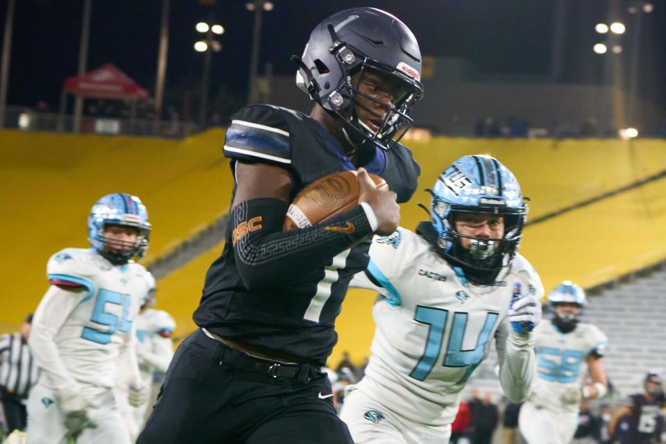 Dec 9, 2022; Tempe, AZ, USA; Higley Knights quarterback Jamar Malone II (1) rushes the ball against the Cactus Cobras during the AIA 5A state championship game at Sun Devil Stadium in Tempe on Friday, Dec. 9, 2022. Mandatory Credit: Alex Gould/The Republic