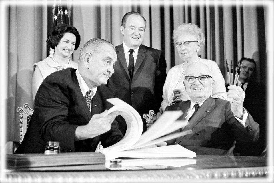 Lyndon Johnson, Harry Truman, foreground; Lady Bird Johnson, Hubert Humphrey, Bess Truman, back