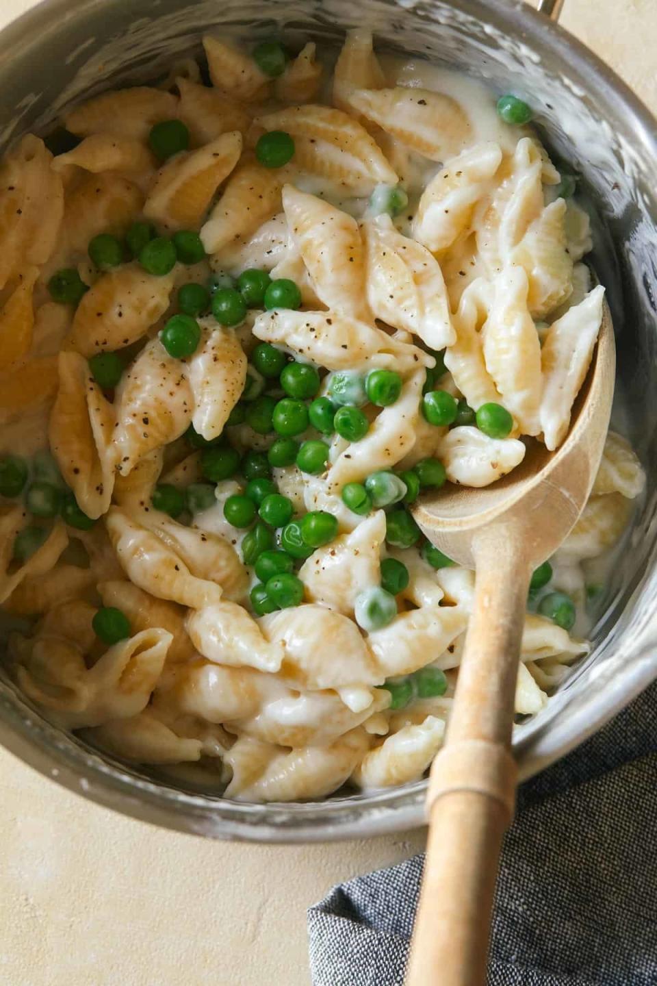 A big pot of creamy mac 'n' cheese shells with peas