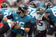 Jacksonville Jaguars quarterback Trevor Lawrence (16) looks for a receiver against the Atlanta Falcons during the first half of an NFL football game, Sunday, Nov. 28, 2021, in Jacksonville, Fla. (AP Photo/Chris O'Meara)