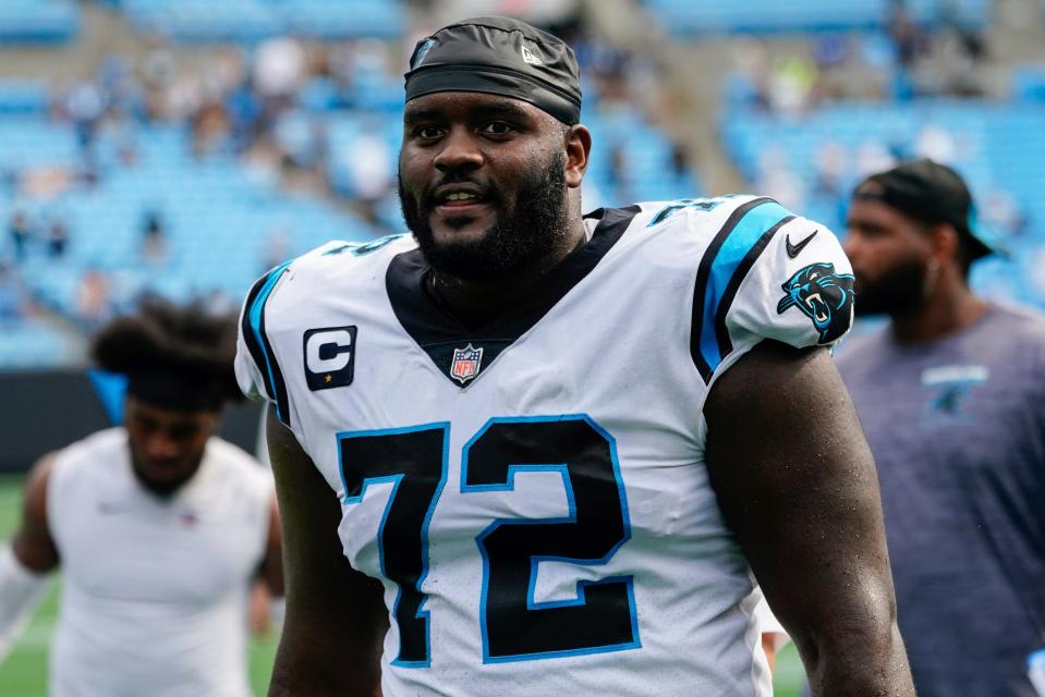 Carolina Panthers offensive tackle Taylor Moton walks off the field after an NFL football game against the New Orleans Saints Sunday, Sept. 19, 2021, in Charlotte, N.C.
