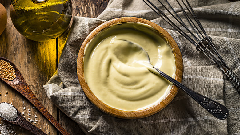 Bowl of mayonnaise with ingredients