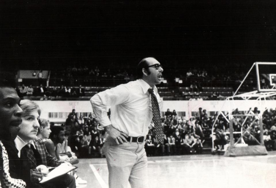 University of Detroit basketball coach Dick Vitale yells energetically from the sidelines on February 18, 1977. The Titans' last second win over Marquette last Wednesday added to the team's current 21-game winning streak.