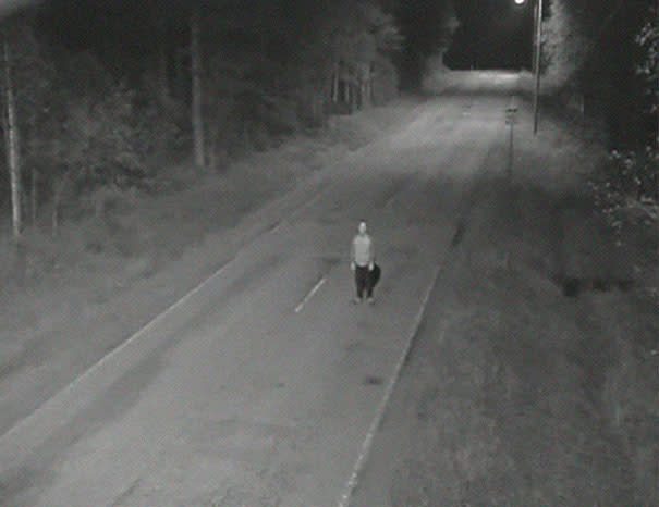 Tatu Gustafsson standing on a dark empty road