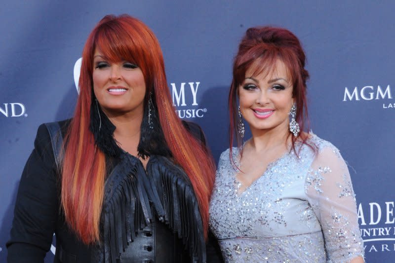 Wynonna Judd (L), pictured with late mom Naomi Judd, announced "Back to Wy," a new tour celebrating her first two solo albums. File Photo by Jim Ruymen/UPI