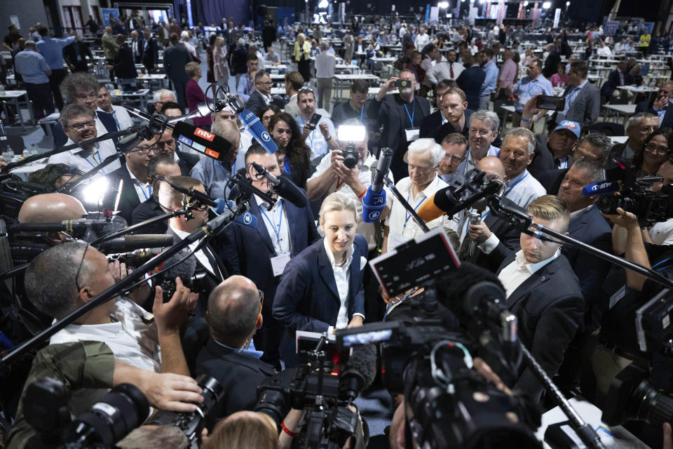 FILE - AfD's Alice Weidel, centre, answers journalists' questions after her election as the second, equal federal spokeswoman at the AfD's federal party conference in Riesa, Germany, June 18, 2022. Prominent members of German mainstream parties have expressed alarm at a new poll released Thursday June 1, 2023, showing support for the far-right Alternative for Germany at a record high. (Sebastian Kahnert/dpa via AP, File)