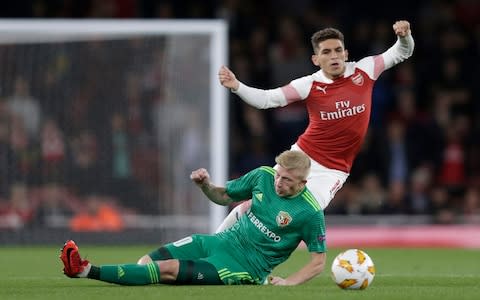 Lucas Torreira of Arsenal is fouled by Vladyslav Kulach of Vorskla Poltava during the UEFA Europa League Group E match between Arsenal and Vorskla Poltava at Emirates Stadium - Credit: Henry Browne/Getty Images