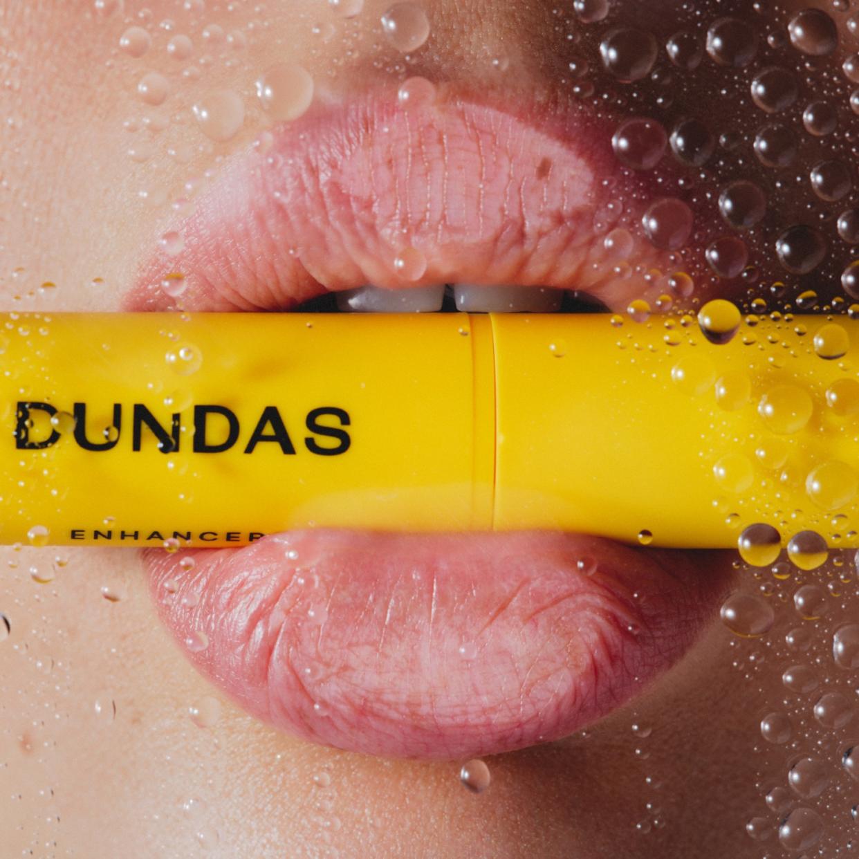  Dundas lip balm in a mouth. 