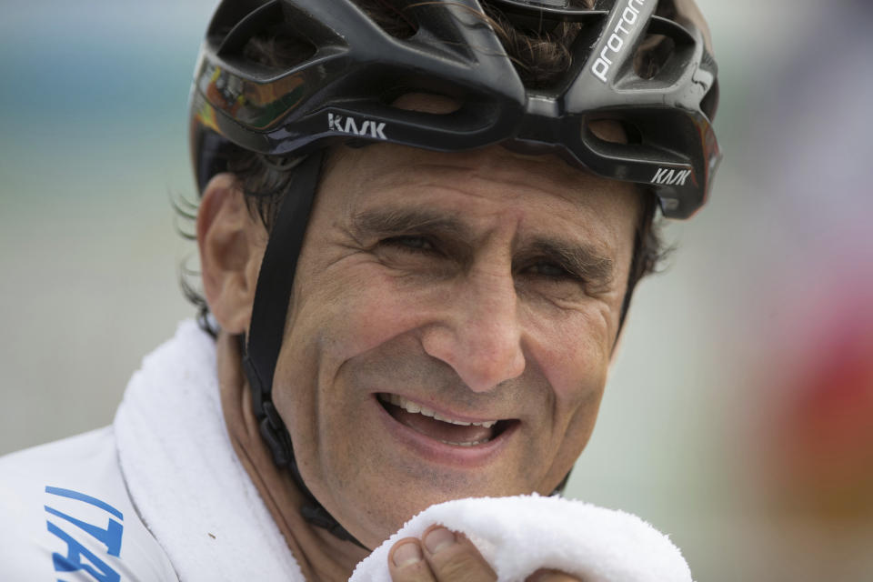 FILE - In this Sept. 15, 2016, file photo, Alex Zanardi, smiles after winning the silver medal in the men's road race H5, during the 2016 Paralympics Games, in Rio de Janeiro, Brazil. Zanardi has accomplished more since he lost both of his legs in a gruesome auto racing crash than many racers do in a lifetime. The latest achievement for the two-time CART champion and four-time Paralympic gold medalist is this weekend’s Rolex 24 at Daytona endurance race. (AP Photo/Mauro Pimentel, File)