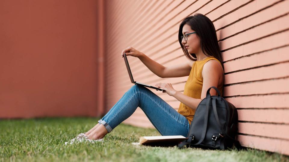 Sideview, Laptop, Sitting, Young Woman, Student, Campus, Outdoors,.