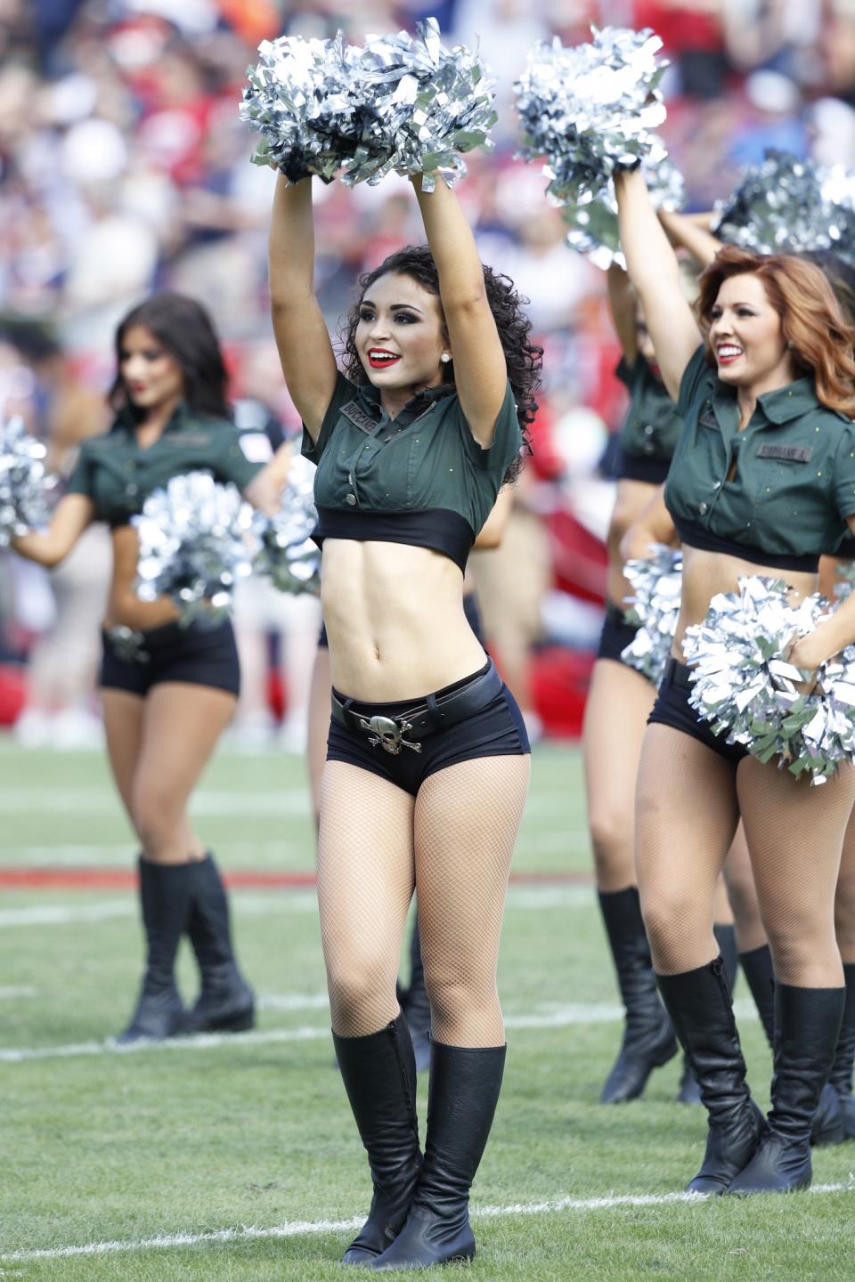 <p>Tampa Bay Buccaneers cheerleader performs while wearing a Salute to Service uniform in the first half of the game against the Chicago Bears at Raymond James Stadium on November 13, 2016 in Tampa, Florida. (Photo by Joe Robbins/Getty Images) </p>