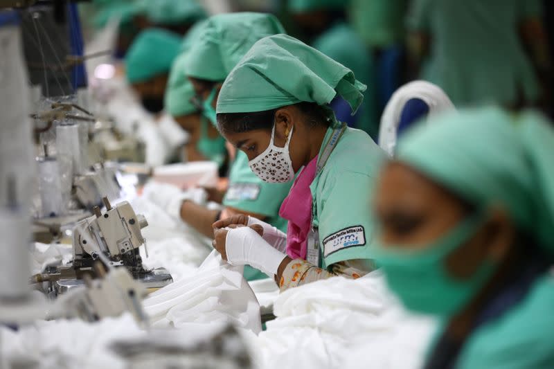 Garment employees work in a sewing section of the Fakhruddin Textile Mills Limited in Gazipur