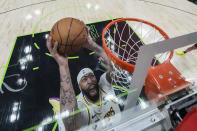 Los Angeles Lakers forward Anthony Davis goes to the basket in the second half of an NBA basketball game against the New Orleans Pelicans in New Orleans, Sunday, April 14, 2024. The Lakers won 124-108. (AP Photo/Gerald Herbert)