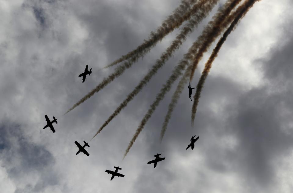 Al Fursan, or the Knights, a UAE Air Force aerobatic display team, perform during the opening day of the International Defence Exhibition & Conference, IDEX, in Abu Dhabi, United Arab Emirates, Sunday, Feb. 21, 2021. (AP Photo/Kamran Jebreili)