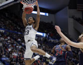 Villanova's Jermaine Samuels (23) dunks against St. Mary's Malik Fitts (24) during the second half of a first round men's college basketball game in the NCAA Tournament, Thursday, March 21, 2019, in Hartford, Conn. (AP Photo/Elise Amendola)