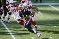 New England Patriots quarterback Cam Newton, front, scrambles away from Arizona Cardinals linebackers De'Vondre Campbell, left, and Kylie Fitts in the first half of an NFL football game, Sunday, Nov. 29, 2020, in Foxborough, Mass. (AP Photo/Elise Amendola)