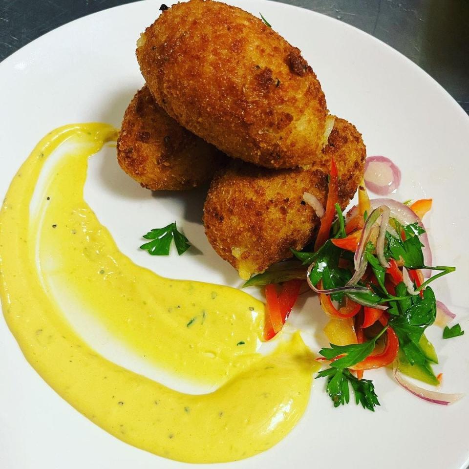 Papas rellenas, a potato dish that originated in Peru but is found throughout Latin America, at Latino Flavor Grille in Stafford.