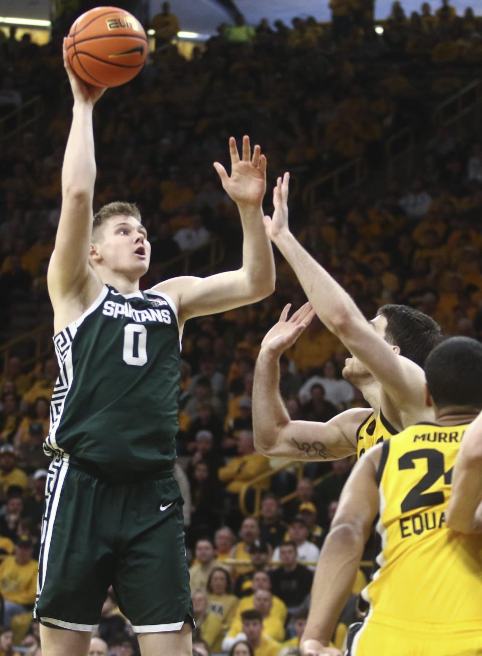 Michigan State forward Jaxson Kohler takes a shot during the first half against Iowa forward Filip Rebraca at Carver-Hawkeye Arena, Feb. 25, 2023 in Iowa City, Iowa.