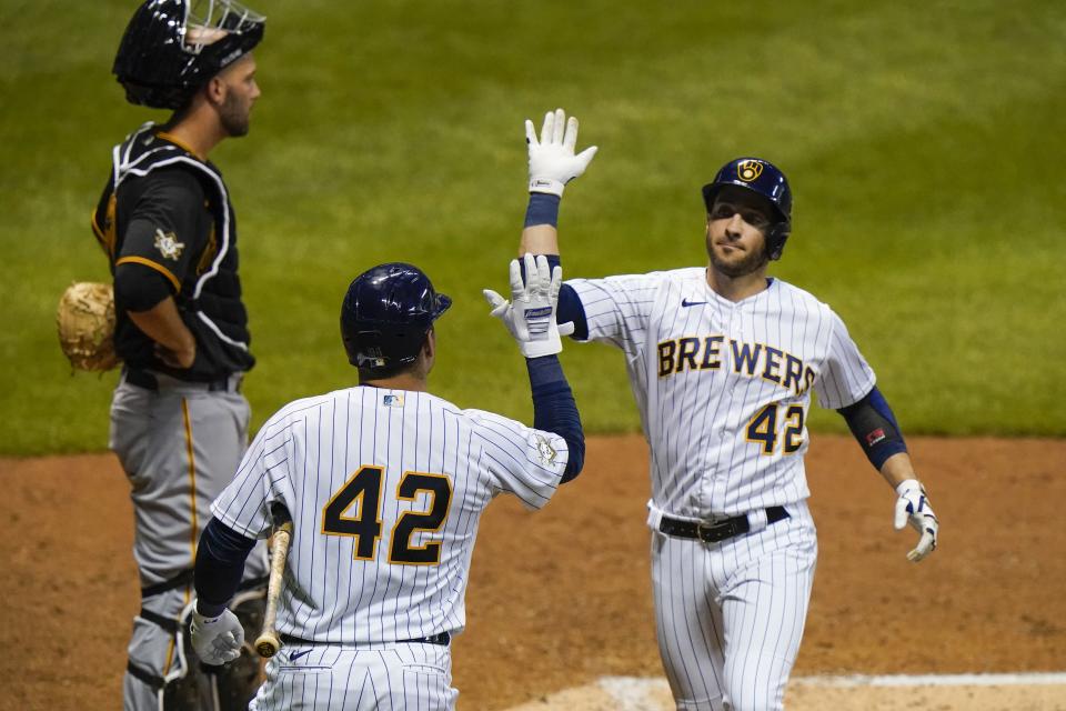 Milwaukee Brewers' Ryan Braun celebrates his three-run home run with Avisail Garcia during the third inning of a baseball game against the Pittsburgh Pirates Friday, Aug. 28, 2020, in Milwaukee. (AP Photo/Morry Gash)