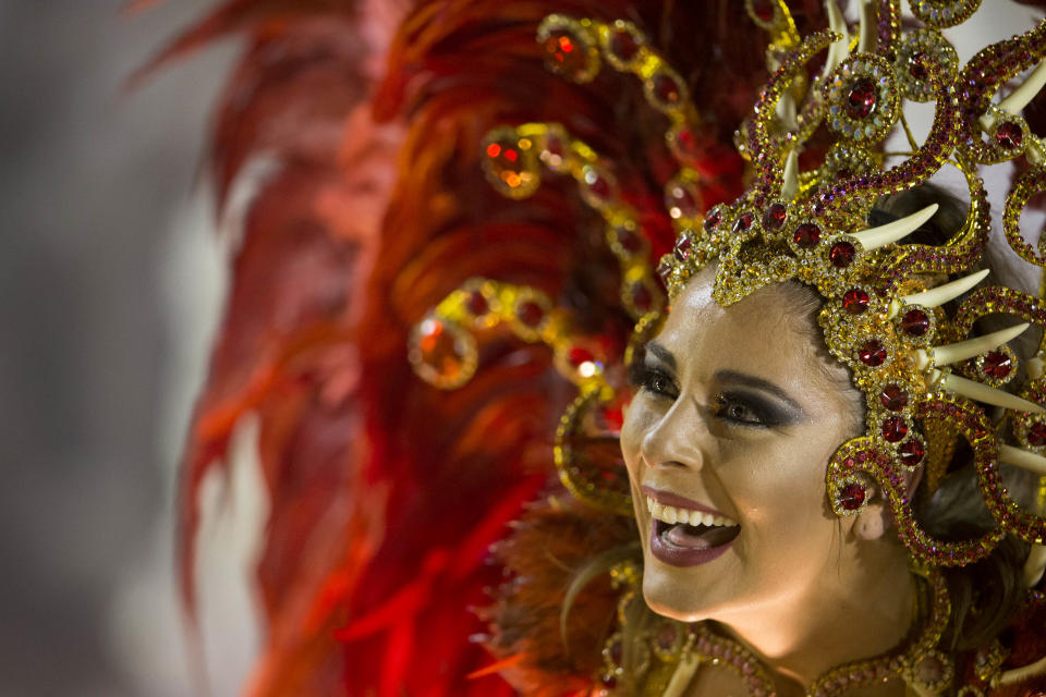 A performer from the Imperio da Tijuca samba school parades on a float during carnival celebrations at the Sambadrome in Rio de Janeiro, Brazil, Sunday, March 2, 2014. (AP Photo/Felipe Dana)