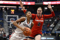 UConn guard Aubrey Griffin is guarded by Dayton guard Taisiya Kozlova (2) in the first half of an NCAA college basketball game, Wednesday, Nov. 8, 2023, in Hartford, Conn. (AP Photo/Jessica Hill)
