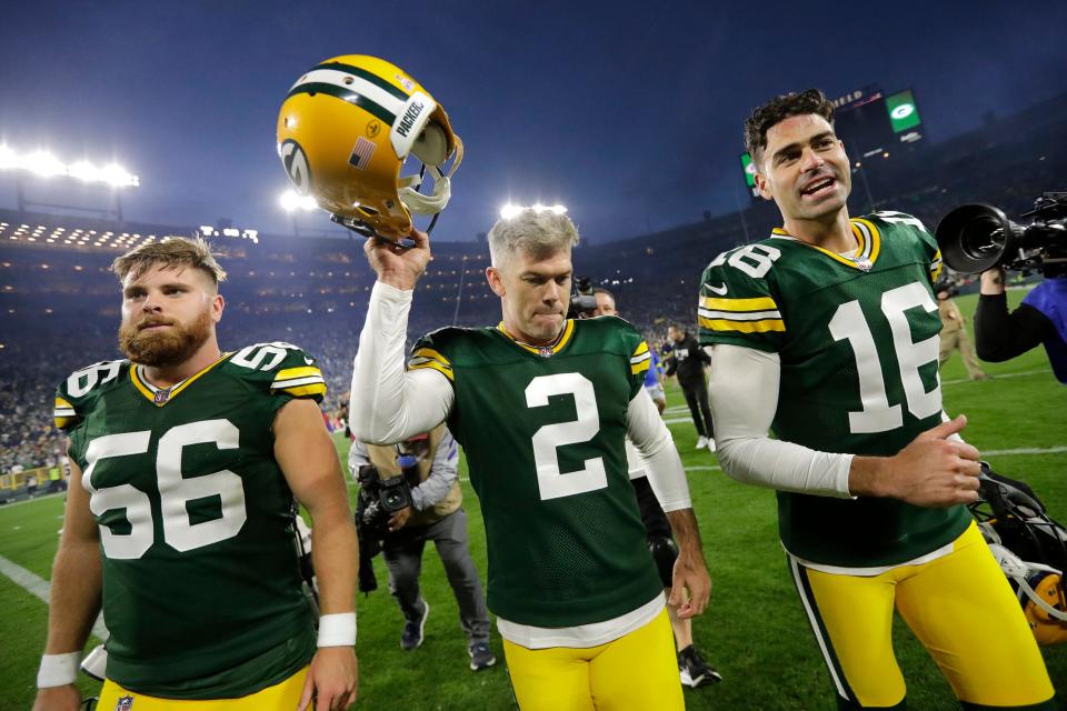 Green Bay Packers place kicker Mason Crosby, middle, celebrates making the game-winning field goal against the New England Patriots as he leaves the field with long snapper Jack Coco, left, and punter Pat O'Donnell Oct. 2 at Lambeau Field.