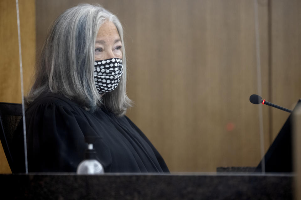 Judge Kathryn Quaintance listens to Mohamed Noor's attorney Tom Plunkett at the Hennepin County Government Center, Thursday, Oct. 21, 2021 in Minneapolis. The Minneapolis police officer who fatally shot an unarmed woman after she called 911 to report a possible rape happening behind her home was sentenced Thursday to nearly five years in prison — the most the judge could impose but less than half the 12½ years he was sentenced to for his murder conviction that was overturned last month. (Elizabeth Flores/Star Tribune via AP, Pool)