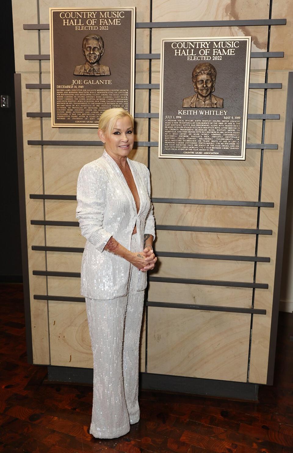 Lorrie Morgan poses with plaque honoring inductee Keith Whitley at the class of 2022 Medallion Ceremony at Country Music Hall of Fame and Museum on October 16, 2022 in Nashville, Tennessee.