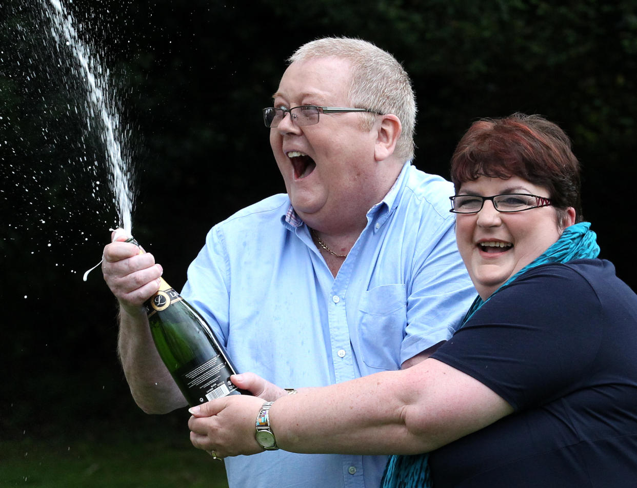 Colin and Chris Weir, from Largs in Ayrshire, celebrate during a photo call at the Macdonald Inchyra Hotel & Spa in Falkirk, after they scooped £161 million in Tuesday's EuroMillions draw.