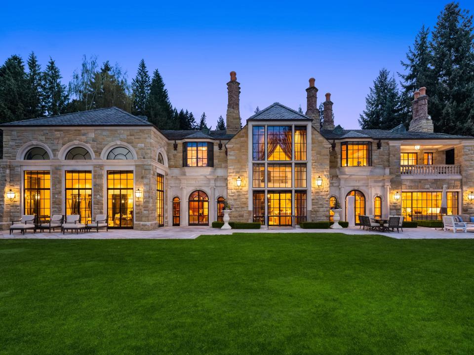 a mansion with the lights on in every room at night in Washington