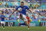 Italy's Andrea Belotti reaches for the ball during the Euro 2020 soccer championship group A match between Italy and Wales, at the Rome Olympic stadium, Sunday, June 20, 2021. (AP Photo/Alessandra Tarantino, Pool via AP)