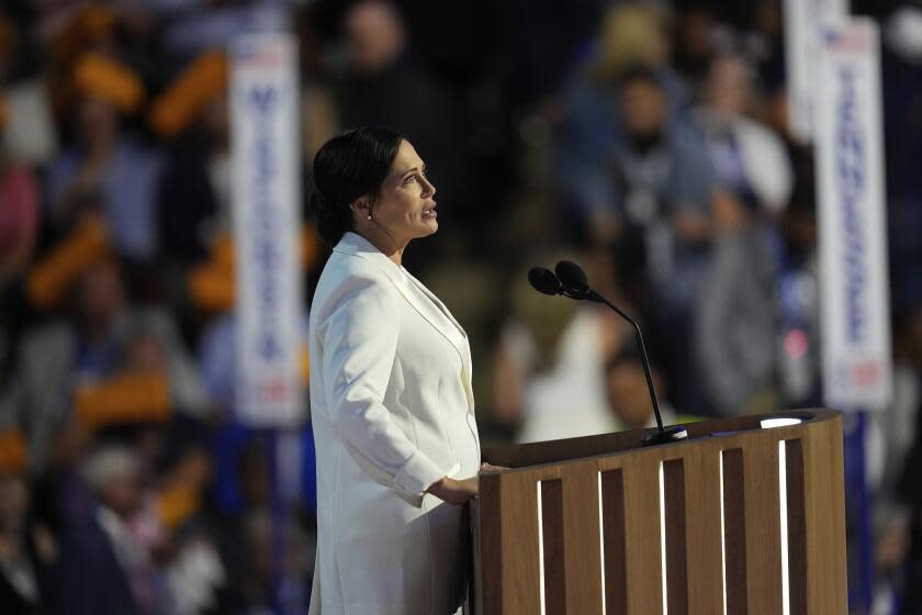 Stephanie Grisham, former Trump White House Press Secretary, speaks during the Democratic National Convention Tuesday, Aug. 20, 2024, in Chicago. (AP Photo/Paul Sancya)