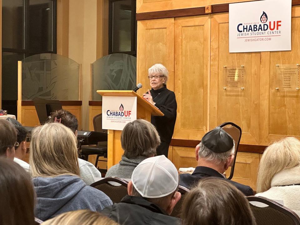 Holocaust survivor Irene Zisblatt shares her story with a standing-room only crowd Monday night at the Chabad UF Jewish Student Center in Gainesville.