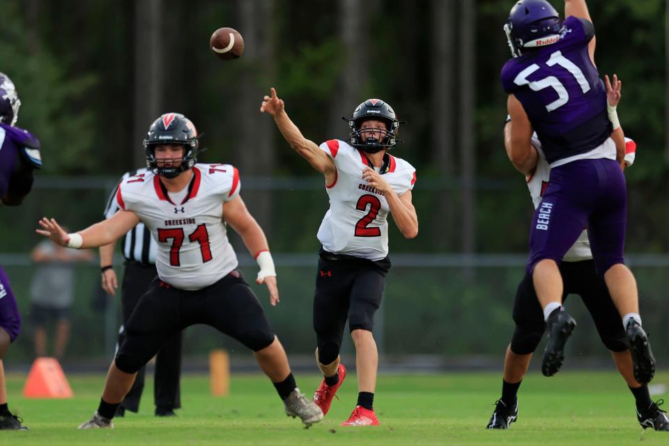 Creekside's Sean Ashenfelder (2) throws a reception for a touchdown run during the second quarter of the Kickoff Classic preseason high school football game Friday, Aug. 18, 2023 at Creekside High School in St. Johns, Florida. The Creekside Knights defeated the Fletcher Senators 37-20.