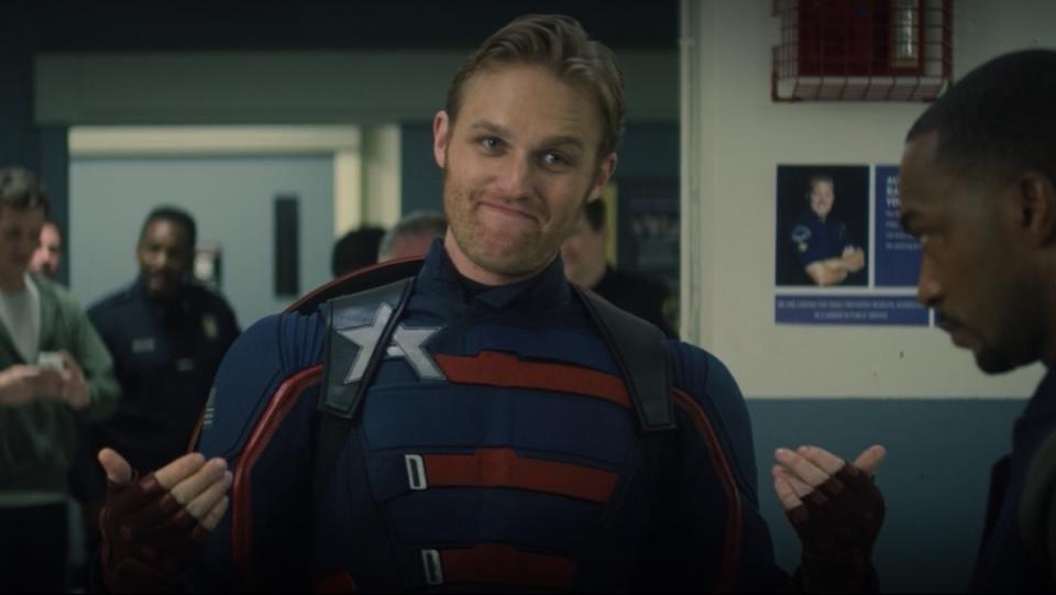 Wyatt Russell in his Captain America suit as Sam Wilson looks on in The Falcon and the Winter Soldier