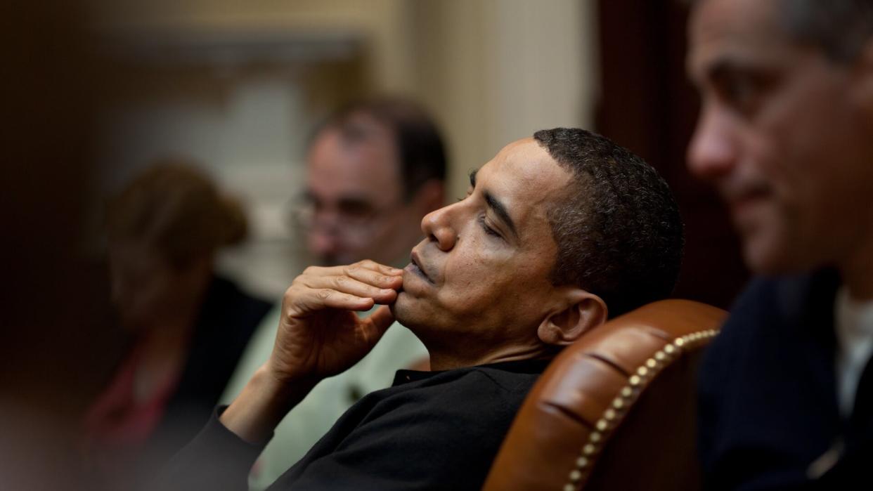 President Obama reflects during an economic meeting with advisors in the Roosevelt Room.