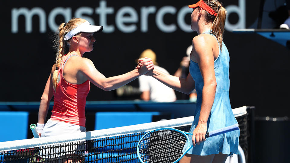 Maria Sharapova shakes hands with Harriet Dart, who burst into tears. (Photo by Michael Dodge/Getty Images)