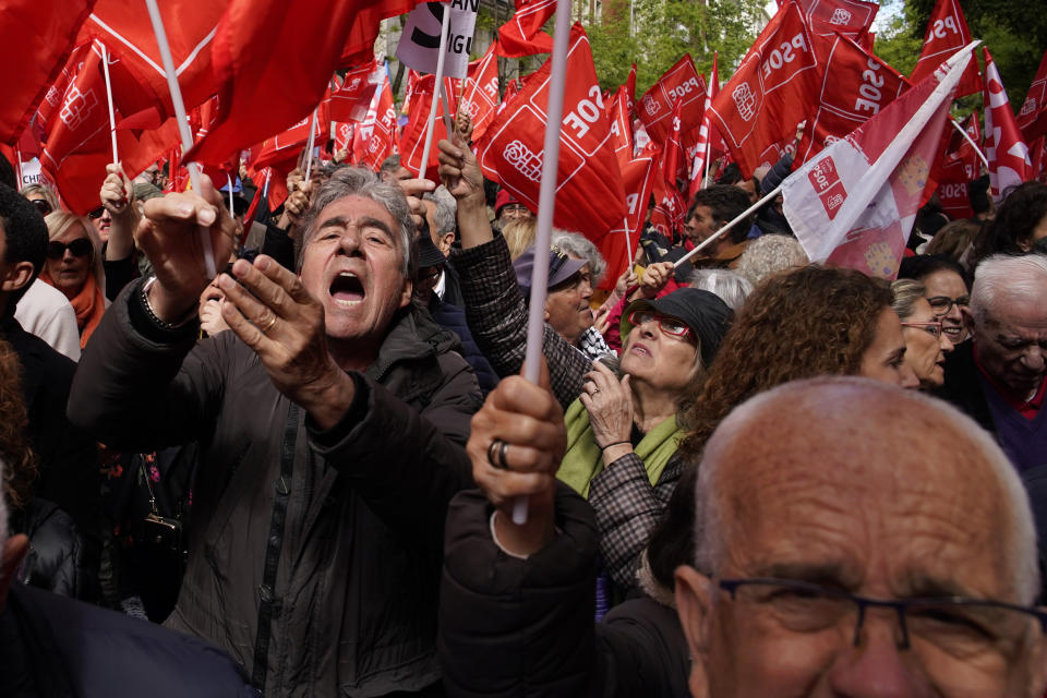Supporters of Spain's Prime Minister Pedro Sánchez gather at the PSOE party headquarter during a demonstration in Madrid, Spain, Saturday, April 27, 2024. Spain is in nail-biting suspense Monday as it waits for Prime Minister Pedro Sánchez to announce whether he will continue in office or not. Sánchez, 52, shocked the country on Thursday, announcing he was taking five days off to think about his future after a court opened preliminary proceedings against his wife on corruption allegations. (AP Photo/Andrea Comas)