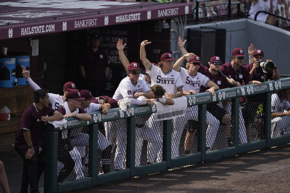 Mississippi State players shout encouragement during an NCAA college baseball super regional game against Notre Dame, Saturday, June 12, 2021, in Starkville, Miss. Mississippi State won 9-8. (AP Photo/Rogelio V. Solis)