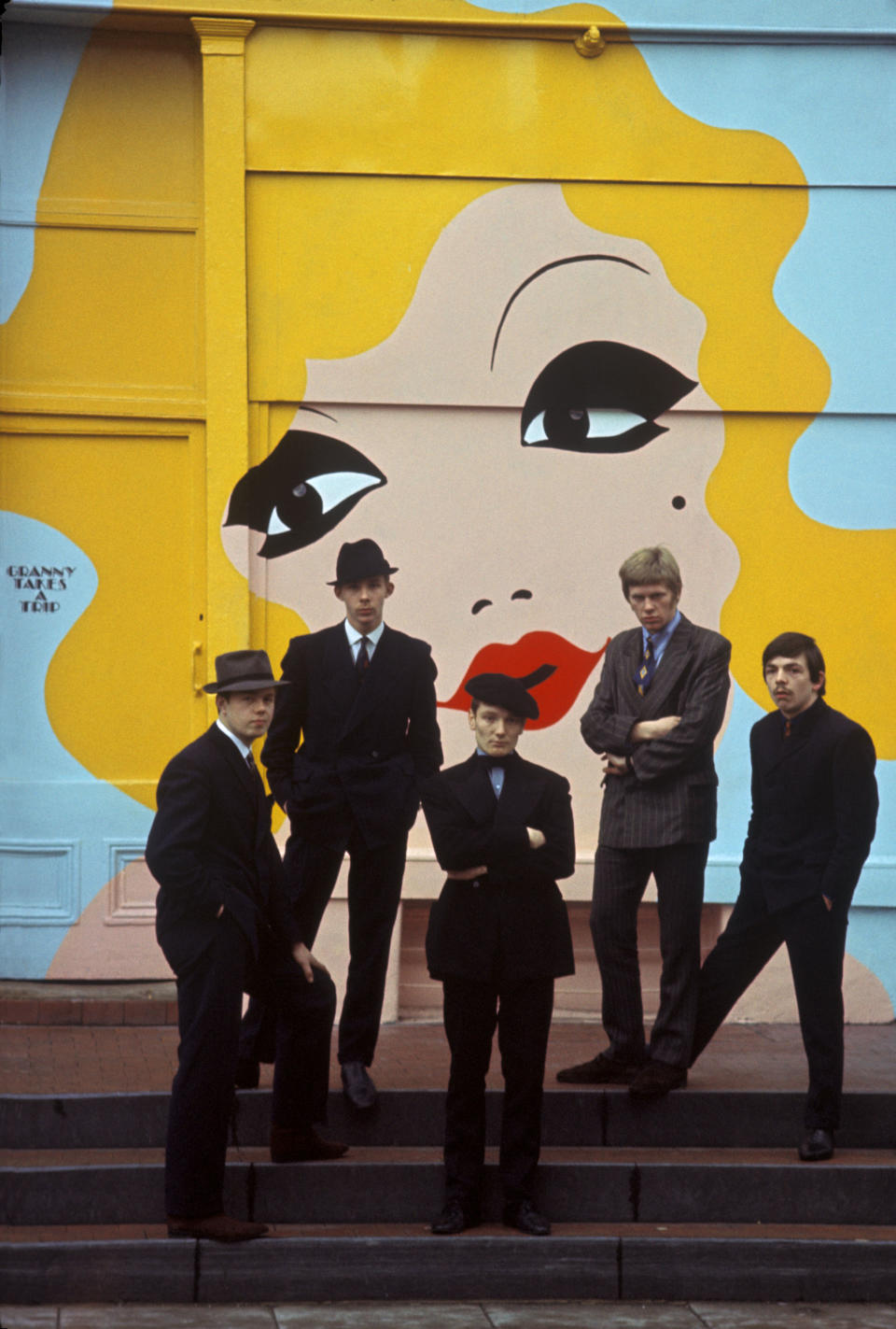 UNITED KINGDOM - JANUARY 01:  Photo of PURPLE GANG (UK); Posed group portrait - The Purple Gang outside the shop 'Granny Takes a Trip' in Chelsea, L-R Joe Beard, Peter Walker, Geoff Bowyer, Trevor Langley and Gerry Robinson  (Photo by Brian Shuel/Redferns)