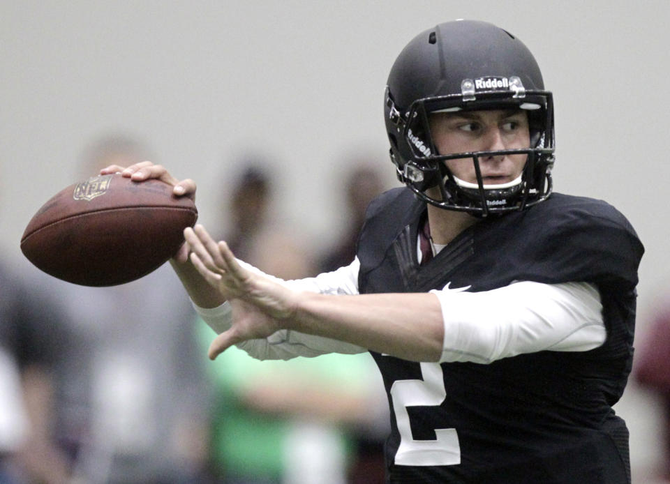 Texas A&M quarterback Johnny Manziel passes the ball during a drill at pro day for NFL football representatives in College Station, Texas, Thursday, March 27, 2014. (AP Photo/Patric Schneider)